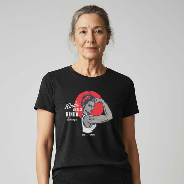 Confident woman in her 70s wearing Kinda Vintage Kinda Savage Rosie unisex triblend tee in black.