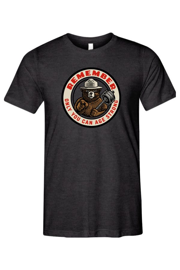 Black t-shirt with a bear graphic and text that says REMEMBER ONLY YOU CAN AGE STRONG on a white background