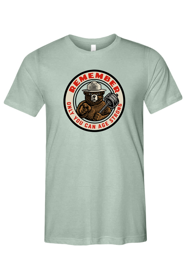 Light green t-shirt with a bear and barbell graphic and text on a white background
