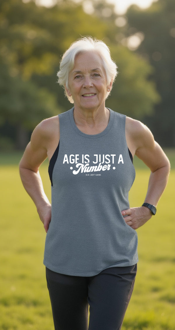 Strong woman wearing an Age is Just a Number blue muscle tank for confidence