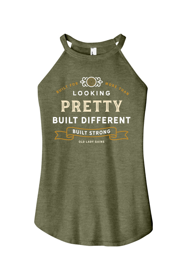 Woman's green halter tank top reading "Built for More Than Looking Pretty. Built Different. Built Strong." by Old Lady Gains, motivational fitness apparel for women over 40.