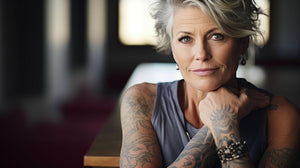 A confident woman in her 50s smiling and lifting weights, showcasing strength and empowerment defying aging stereotypes, embracing her power, and living boldly in the second chapter of life.