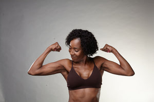 Woman over 50 experiencing menopause but maintaining her strength.