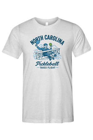 White t-shirt with 'North Carolina Pickleball Takes Flight' design on a white background
