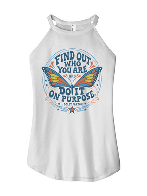 A white sleeveless tank top with a halter-style neck, featuring a colorful graphic print on the front with a butterfly and the text 'FIND OUT WHO YOU ARE AND DO IT ON PURPOSE' by Dolly Parton.