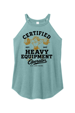 A heathered light blue racerback tank top featuring a vintage-style graphic of a woman lifting a barbell with the text 'CERTIFIED HEAVY EQUIPMENT Operator' in black and gold.