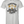 A light gray short-sleeve t-shirt with a vintage-style graphic on the front. The graphic features a retro illustration of a woman lifting a barbell, with the text 'CERTIFIED HEAVY EQUIPMENT Operator' in black and gold lettering.