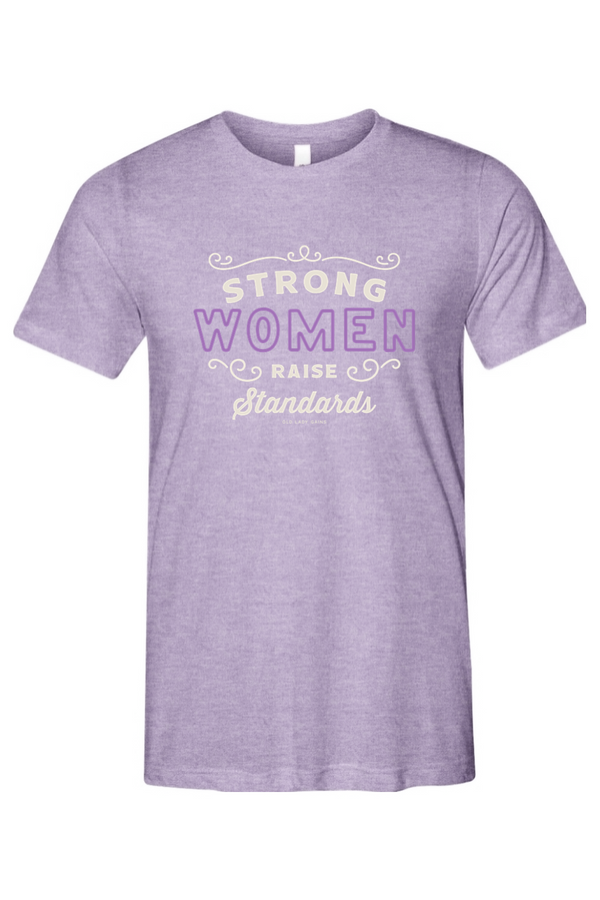 Purple t-shirt with motivational text that read strong women raise standards on a white background