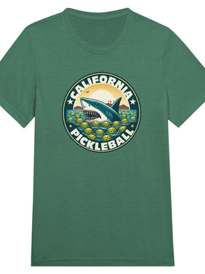 Vintage California pickleball t-shirt graphic featuring a great white shark swimming through floating pickleballs with bold retro typography.