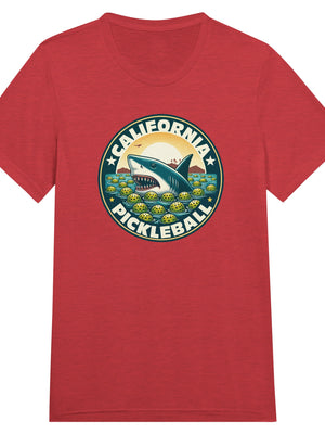 Vintage California pickleball t-shirt graphic featuring a great white shark swimming through floating pickleballs with bold retro typography.