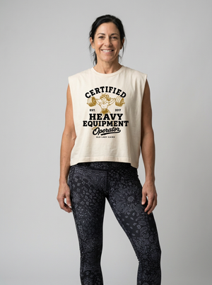Vintage Certified Heavy Equipment Operator muscle tank featuring a retro strong woman lifting a heavily loaded barbell overhead. Funny weightlifting shirt for women over 40 who love strength training, CrossFit, Hyrox, and building muscle.