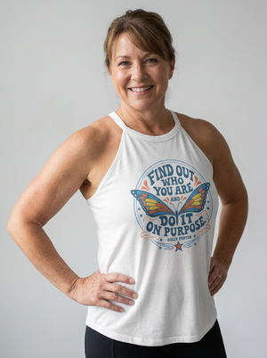 White halter tank with a blue and orange butterfly graphic and Dolly Parton quote "Find out who you are and do it on purpose"