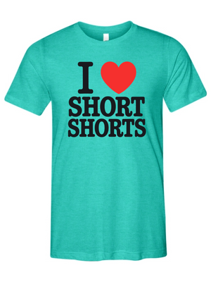 A teal heather short-sleeve t-shirt with a graphic print on the chest reading 'I' followed by a red heart and 'SHORT SHORTS' in bold black letters, shown on a plain white background.