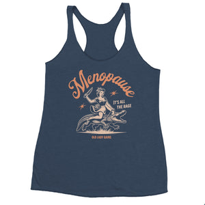 A woman wearing a green racerback tank top with a graphic that says 'Menopause: It's All The Rage' and features an illustration of a woman riding a bike.