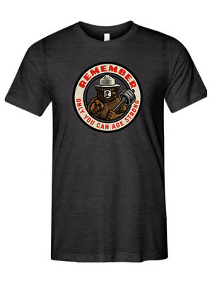 Black t-shirt with a bear graphic and text that says REMEMBER ONLY YOU CAN AGE STRONG on a white background