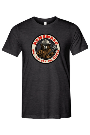 Black t-shirt with a bear graphic and text that says REMEMBER ONLY YOU CAN AGE STRONG on a white background
