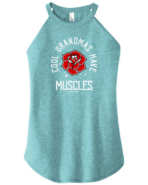 A woman wearing a navy blue high-neck halter tank top with text and a graphic on it that reads Cool Grandmas Have Muscles
