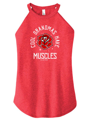 A woman wearing a red blue high-neck halter tank top with text and a graphic on it.