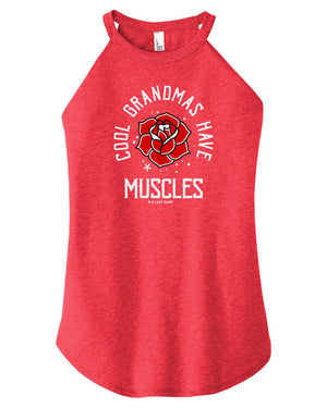 A woman wearing a red blue high-neck halter tank top with text and a graphic on it.