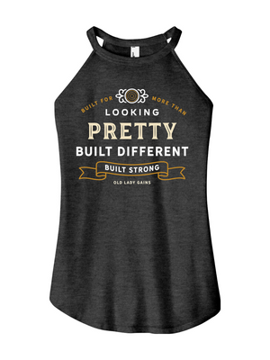 Woman's black halter tank top reading "Built for More Than Looking Pretty. Built Different. Built Strong." by Old Lady Gains, motivational fitness apparel for women over 40.