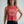 Confident middle-aged woman wearing a red tank top with 'Lift More Weights' text on a white background