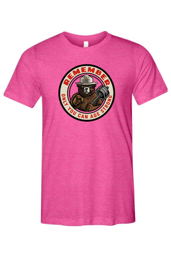Pink t-shirt with a bear graphic and text on a white background