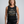 Confident woman over 50 wearing the Built for More Than Looking Pretty muscle workout tank top