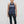Confident older woman in workout tank top with bold “Still Doing It” graphic fitness clothing