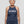 Older athletic woman wearing “Still Doing It” halter tank top for women over 40 fitness apparel