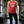 Woman standing in gym wearing an old lady gains red halter tank with graphic reads 