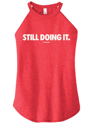 Red tank top with 'STILL DOING IT.' text on a white background