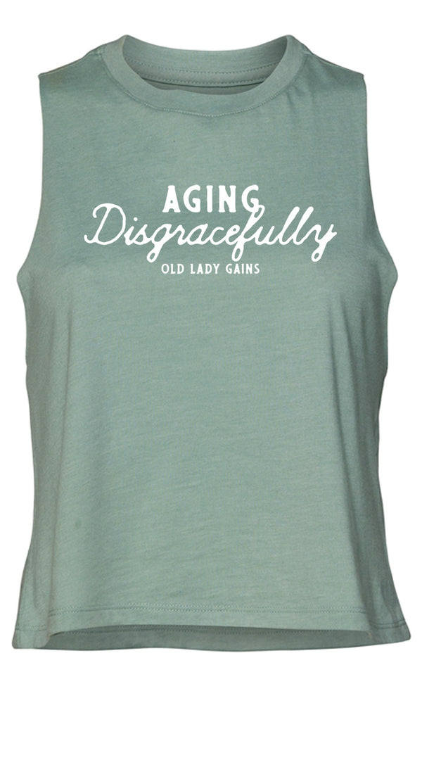 Fun and empowering "Aging Disgracefully" text print on a mint crop tank top