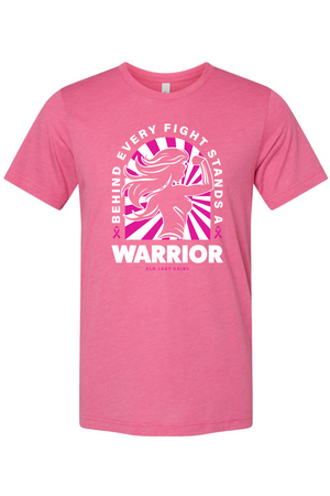 A pink short-sleeve crewneck t-shirt with a graphic on the front featuring a stylized fighter's silhouette in pink and white, with the text 'BEHIND EVERY FIGHT STANDS A WARRIOR' and 'OLD LADY GOATS'.