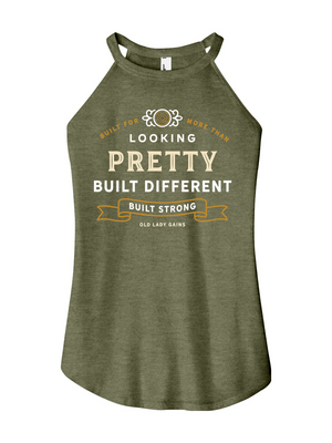 Woman's green halter tank top reading "Built for More Than Looking Pretty. Built Different. Built Strong." by Old Lady Gains, motivational fitness apparel for women over 40.