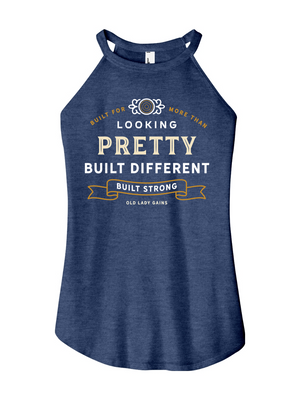 Woman's navy halter tank top reading "Built for More Than Looking Pretty. Built Different. Built Strong." by Old Lady Gains, motivational fitness apparel for women over 40.