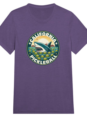 Vintage California pickleball t-shirt graphic featuring a great white shark swimming through floating pickleballs with bold retro typography.