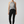 Active woman over 60 wearing Life Moves Fast Keep Up grey halter tank.