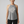 Active woman over 60 wearing Life Moves Fast Keep Up grey halter tank.