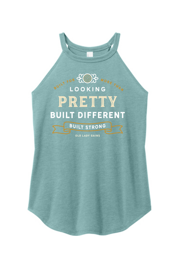 Woman's eucalyptus halter tank top reading "Built for More Than Looking Pretty. Built Different. Built Strong." by Old Lady Gains, motivational fitness apparel for women over 40.
