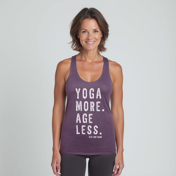 Woman wearing a purple tank top with 'Yoga More. Age Less.' text on a plain background